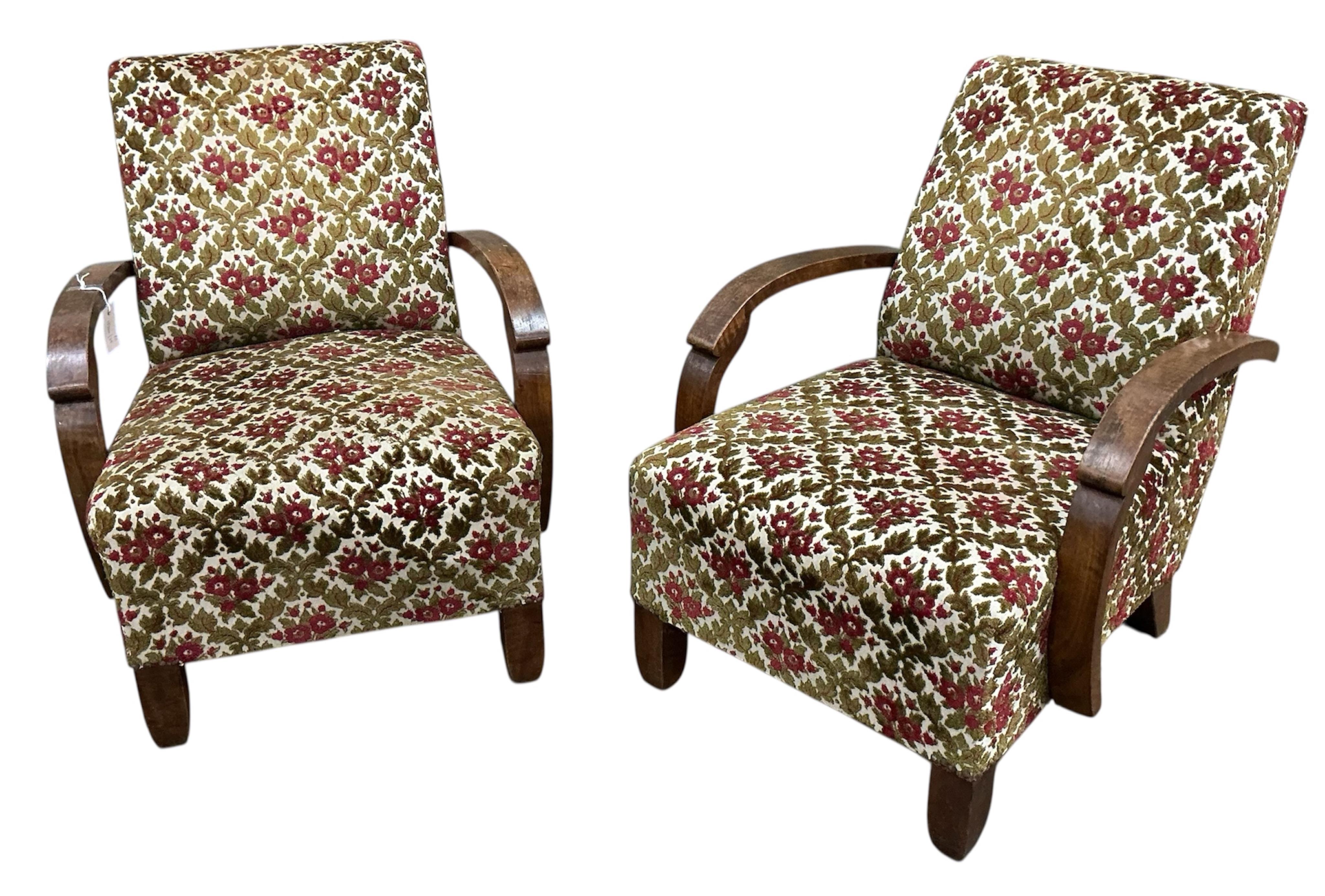 A pair of French Art Deco walnut armchairs, width 65cm, depth 74cm, height 80cm